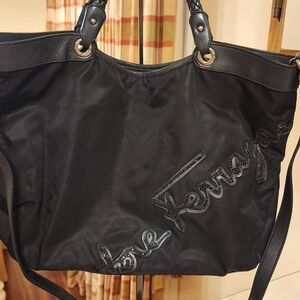 black Salvatore Ferragamo nylon tote bag featuring a prominent embroidered scrip